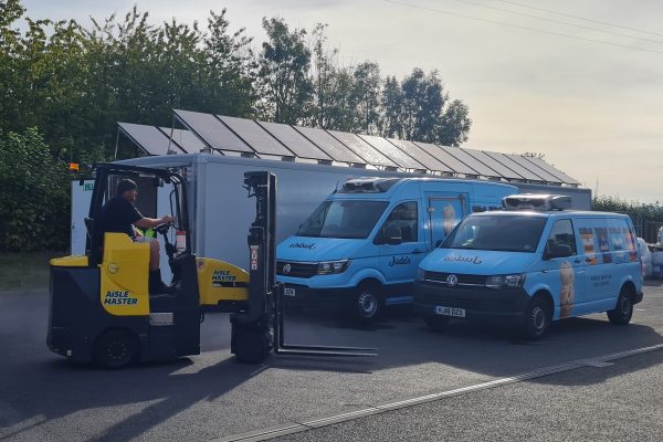 Jude's Ice Cream - forklift and vans in front of solar powered cold storage