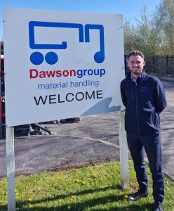 Marcus Worrall in front of Dawsongroup sign