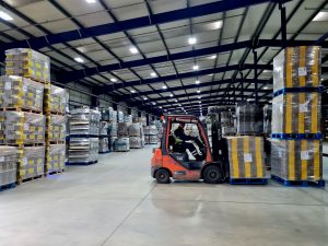 Sheard Packaging - forklift carrying packaging in warehouse